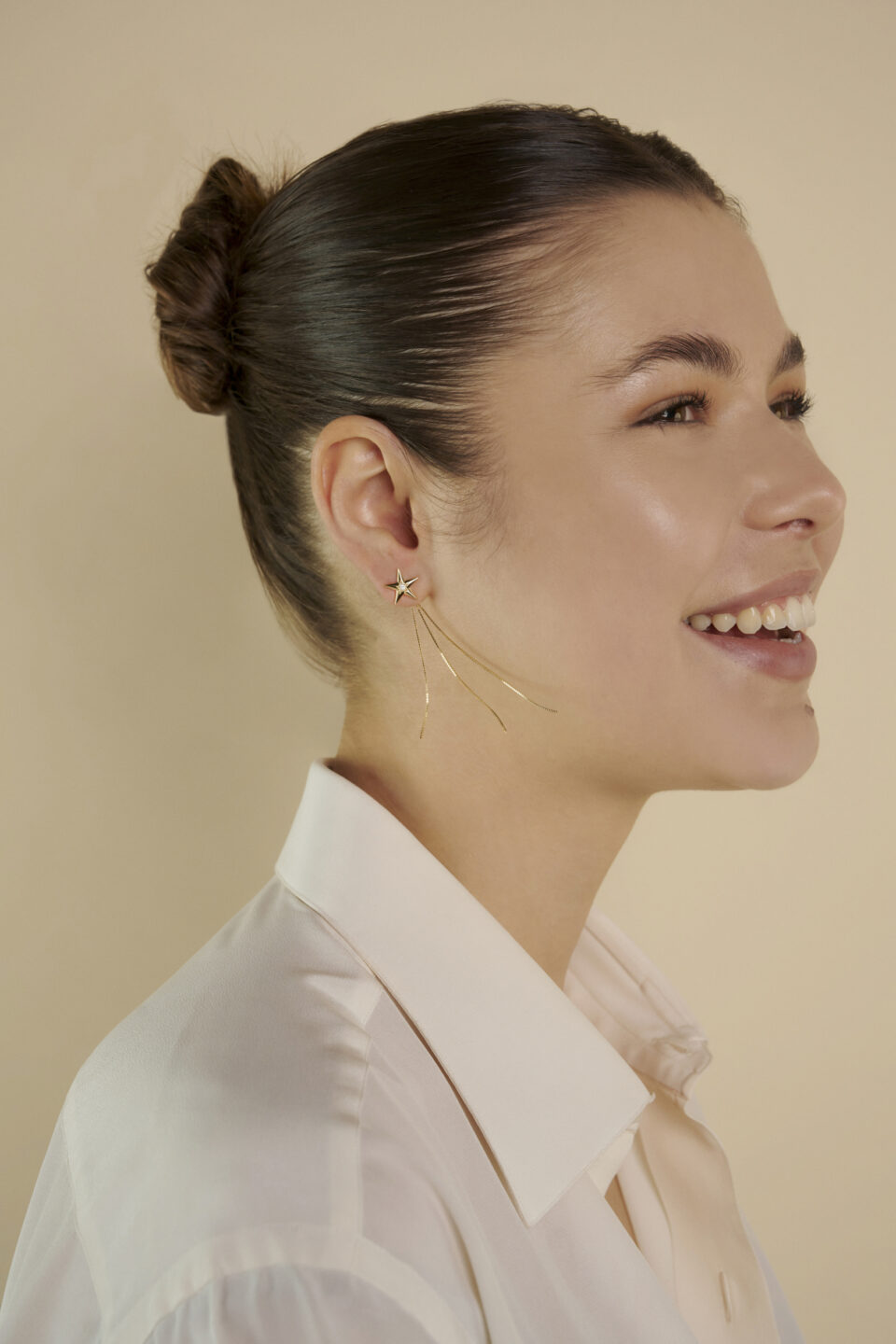 Design artigianale orecchino stella cadente in oro